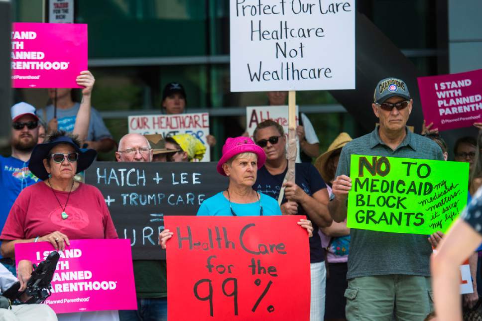 Chris Detrick  |  The Salt Lake Tribune
Protesters participate in a rally against the Senate GOP health care bill outside the Wallace Bennett Federal Building on Tuesday, June 27, 2017.
